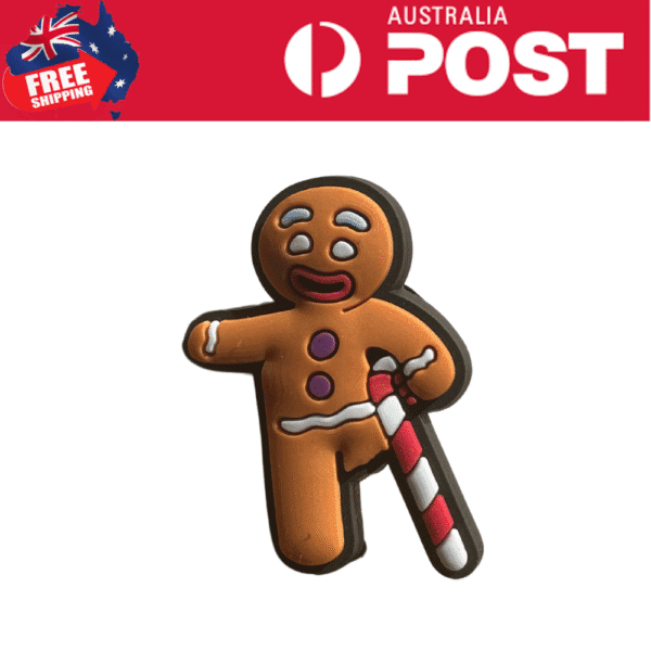 Gingerbread man cookie with crying face and candy cane, Christmas-themed treat.
