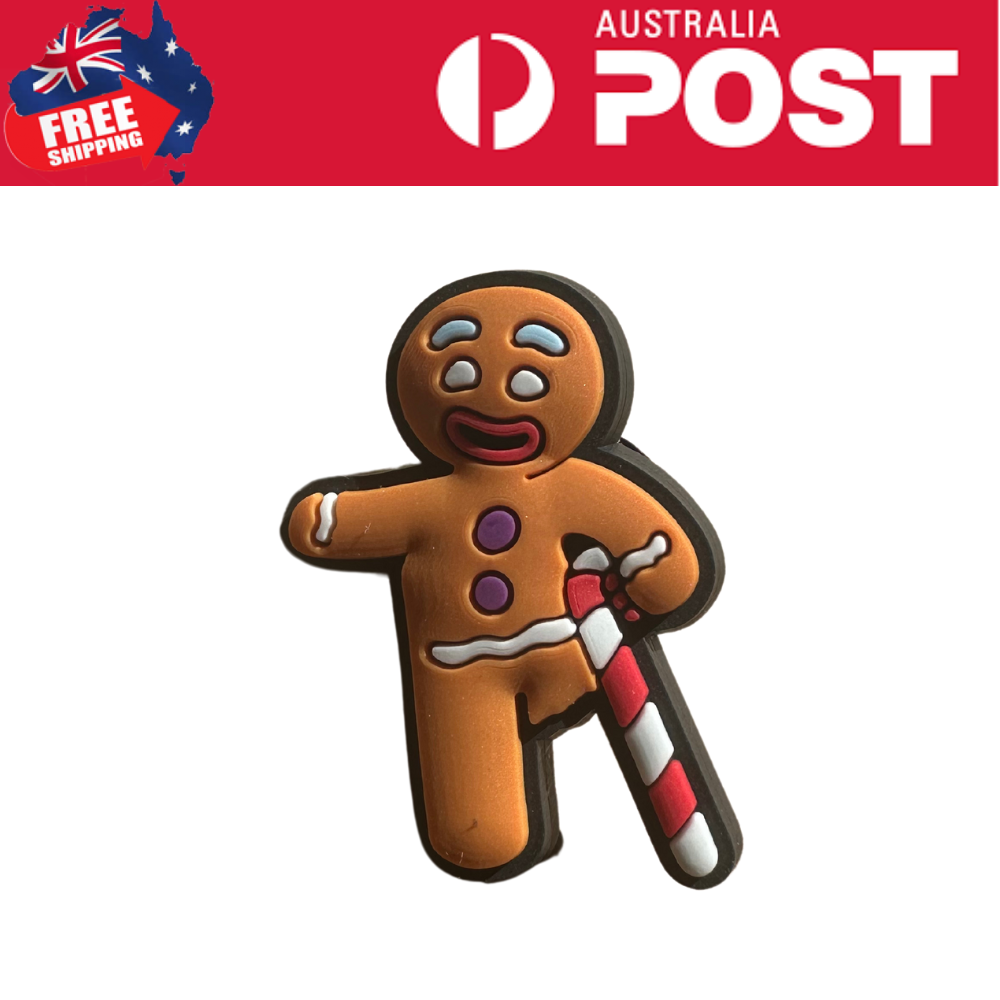 Gingerbread man cookie with crying face and candy cane, Christmas-themed treat.