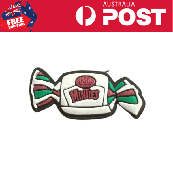 Colorful Minsties candy shaped cookie with festive green, red, and white icing details.