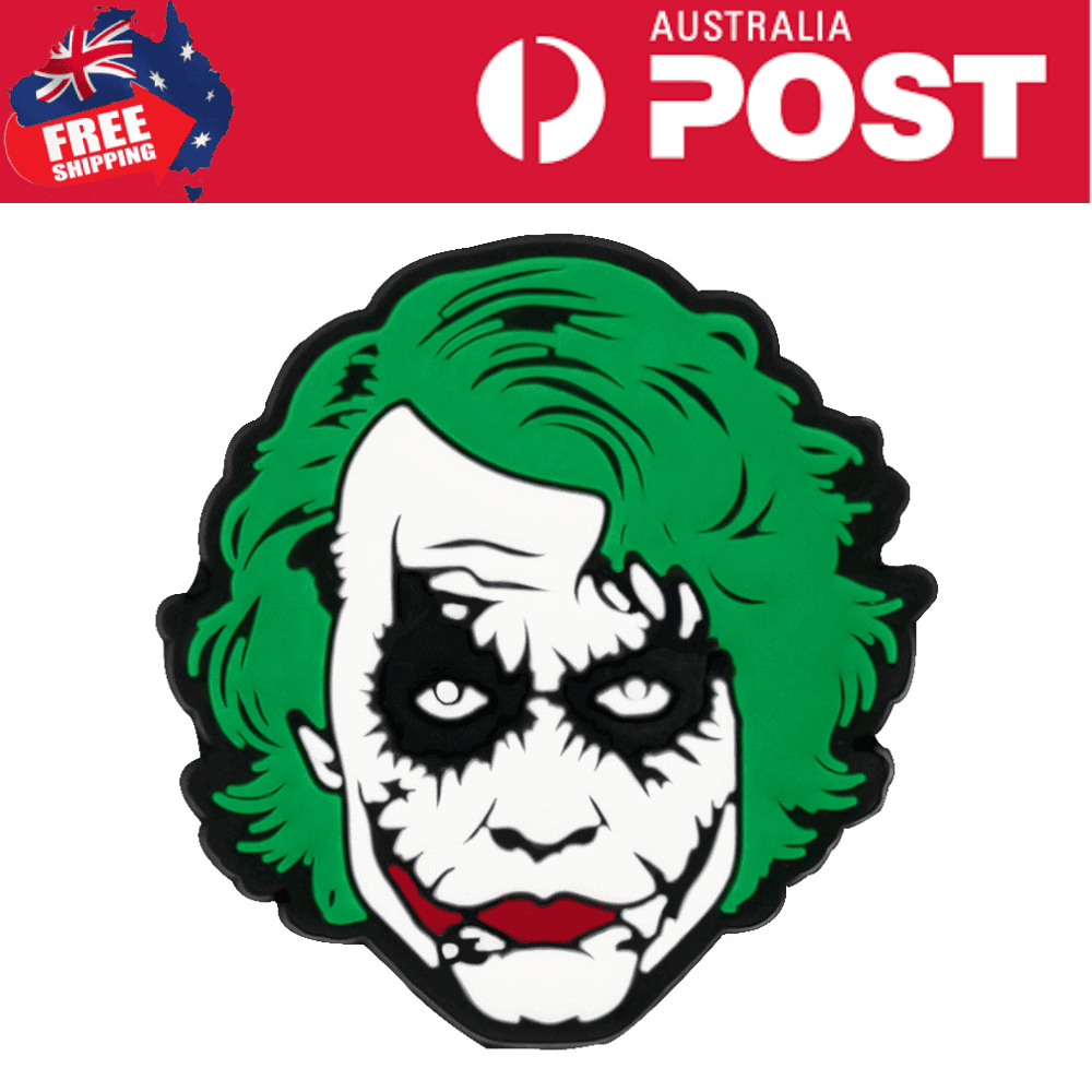 Green-haired clown face patch, gothic style, vibrant design for apparel or accessories.