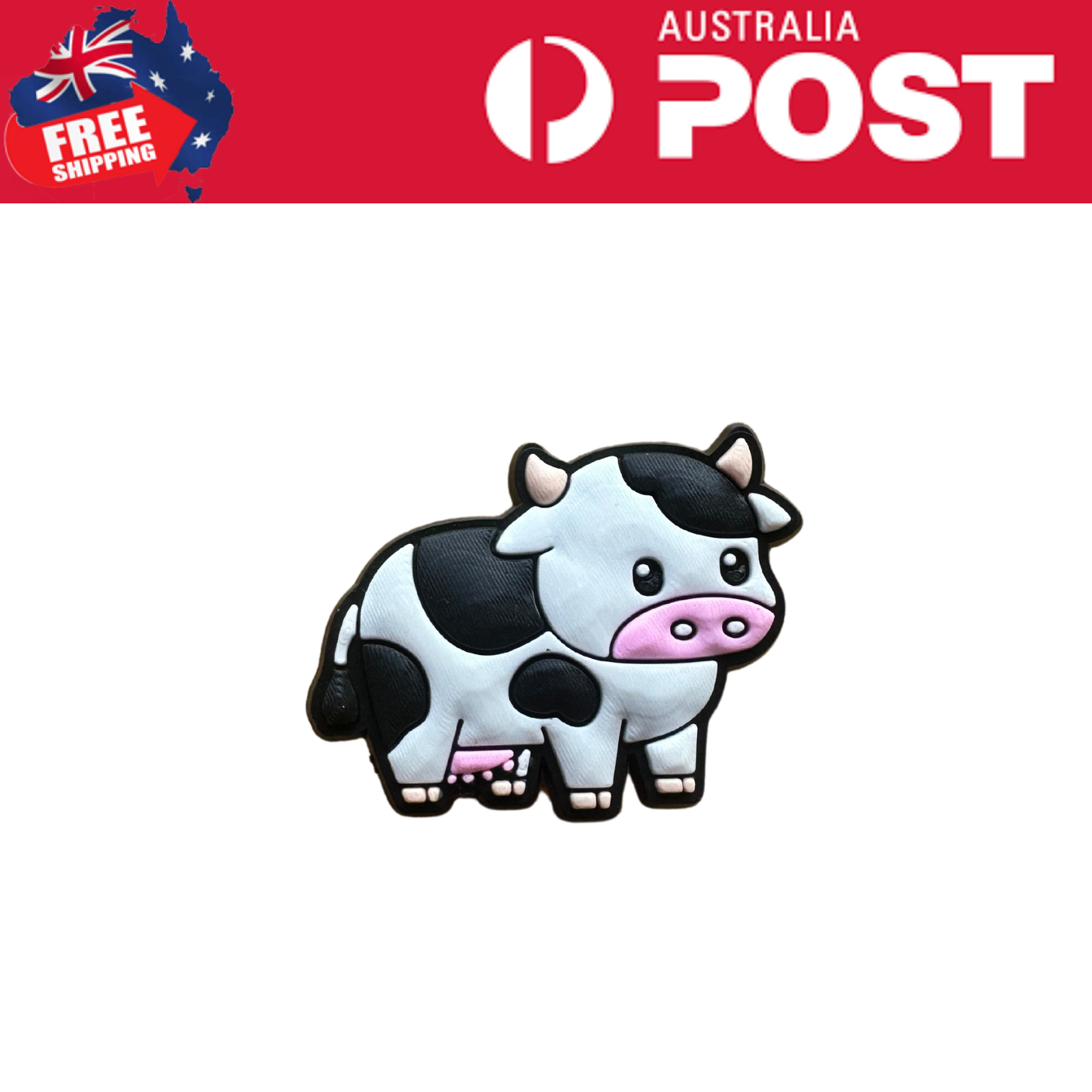 Cute cow-shaped rubber keychain, black and white with pink accents, perfect for accessories and gifts.