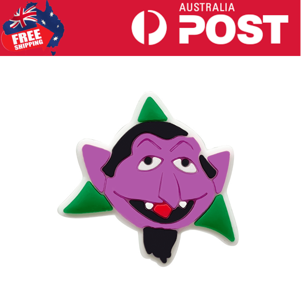 Purple cartoon vampire character magnet with green accents, fun Halloween home decor.