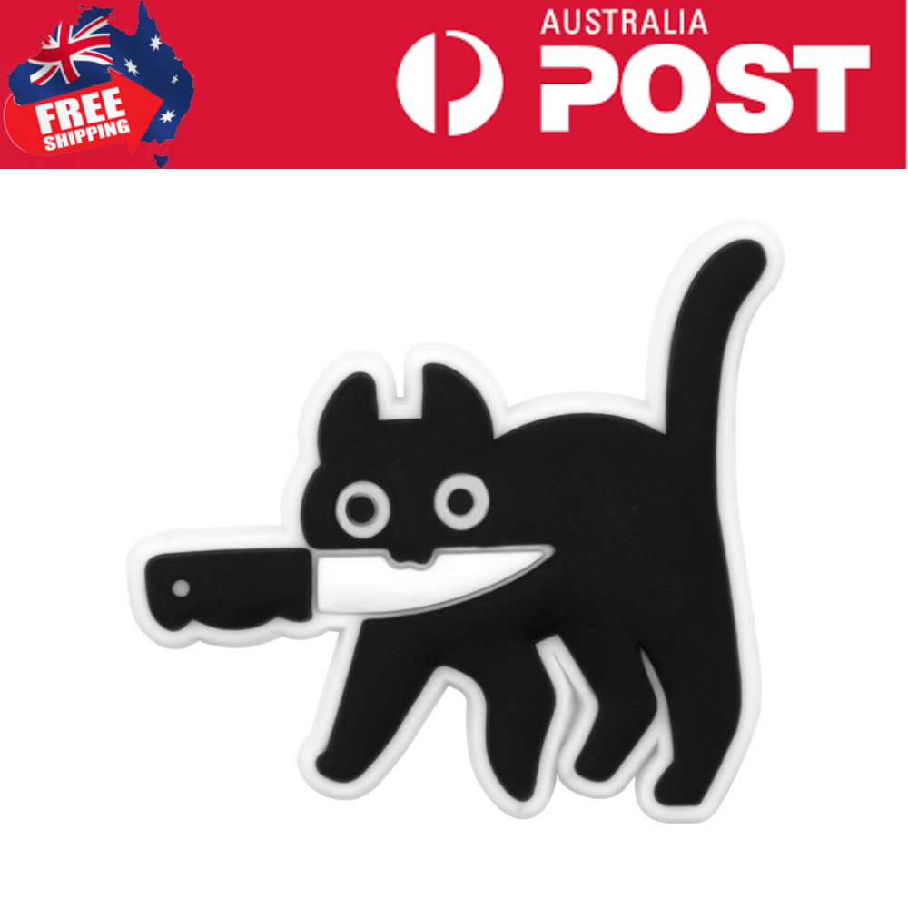 Dog-shaped silicone keychain with a knife in its mouth, black and white design, perfect for accessories.