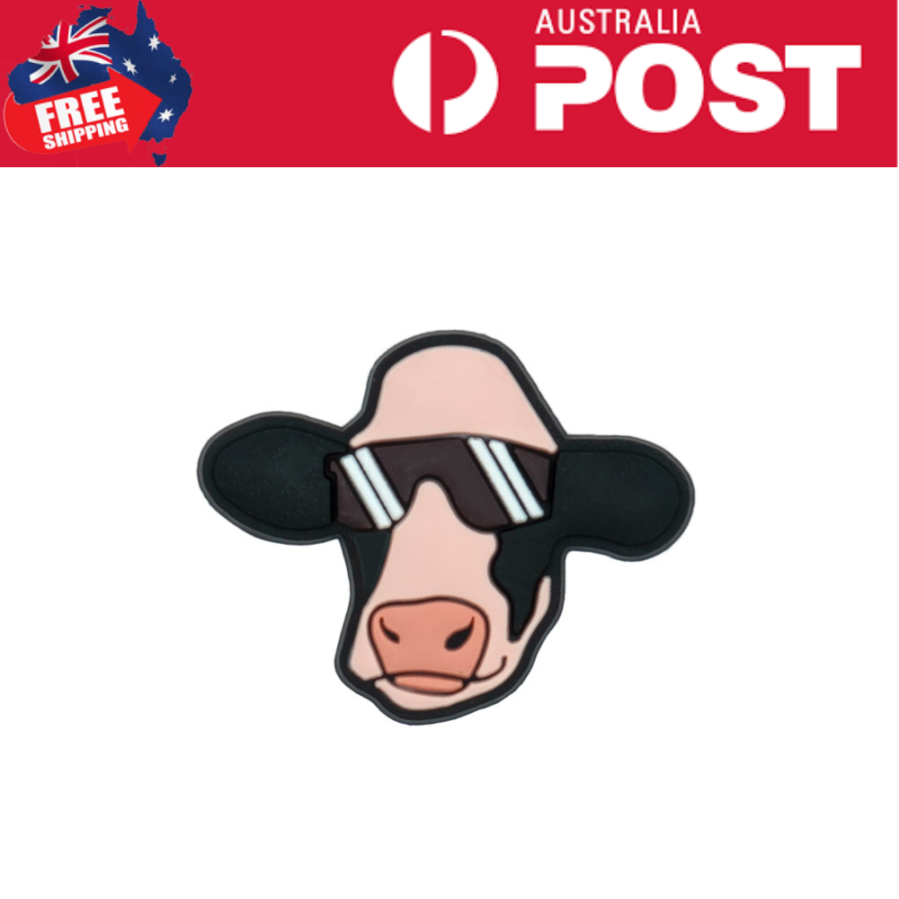 Cute cow pin wearing sunglasses, trendy accessory for fashion and animal lovers.