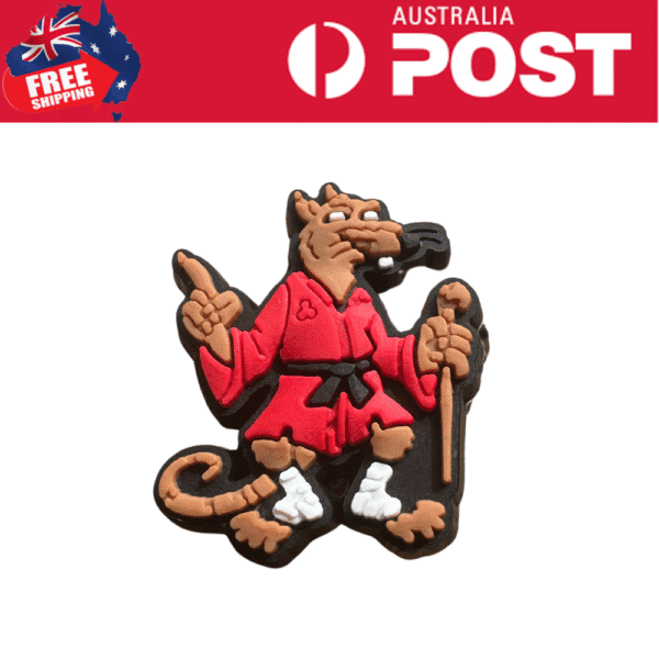Colorful cartoon monkey cookie in a martial arts outfit holding a staff.