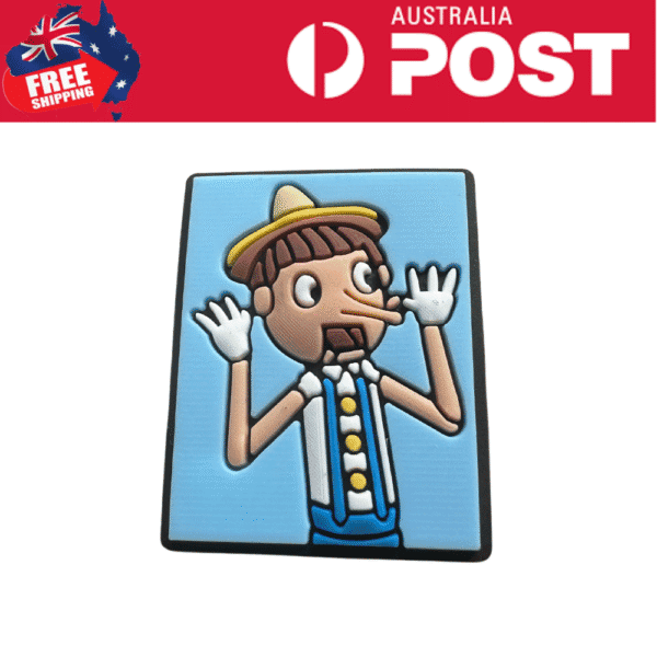 Colorful cartoon rubber badge of Pinocchio character with a blue background, exploring new style accessories.