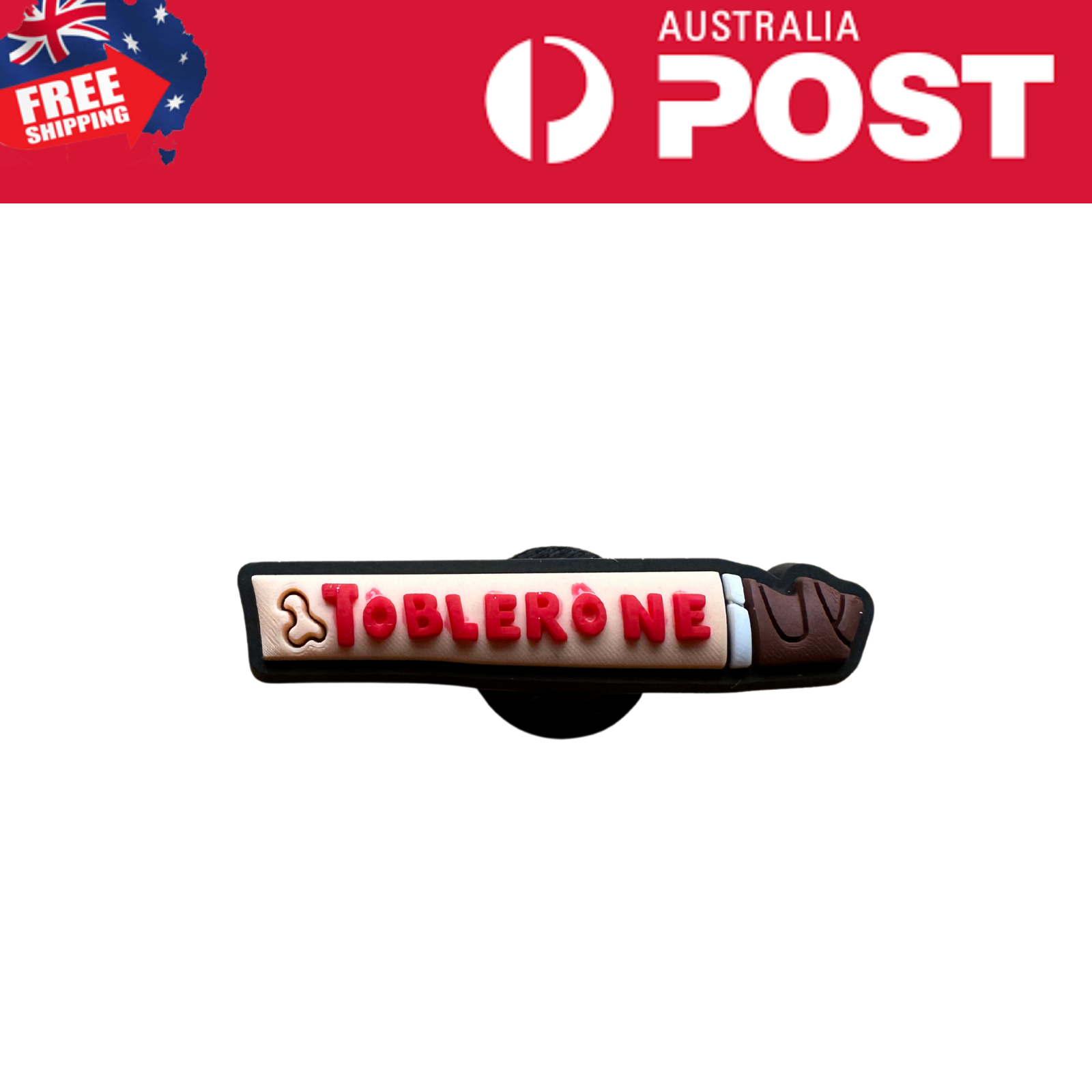 Toothbrush-shaped Toblerone chocolate bar with pink lettering and chocolate details.